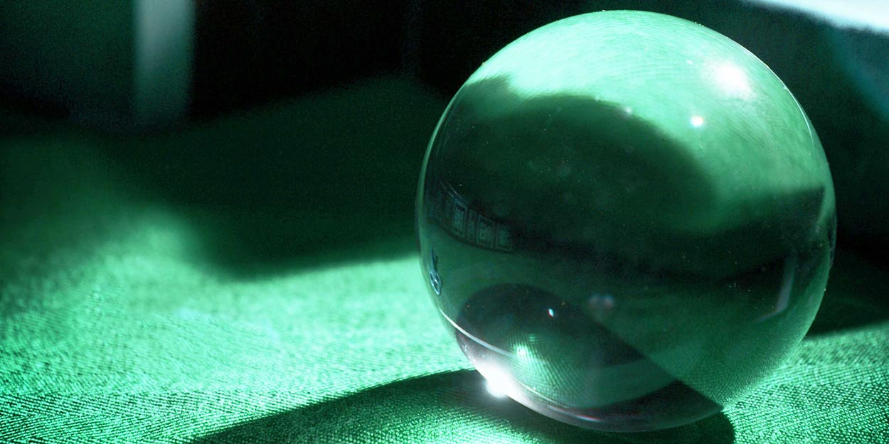 glass marble on green background