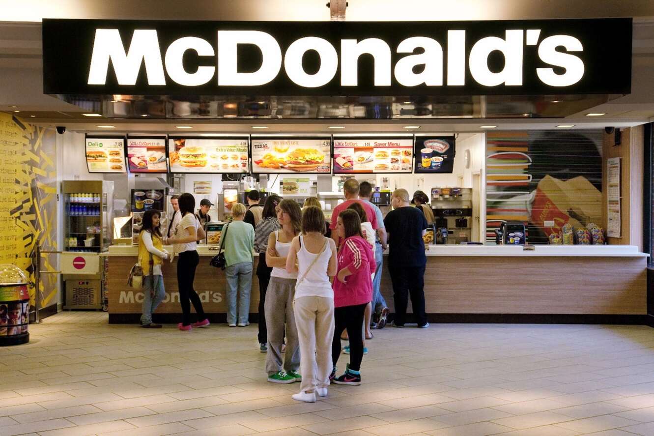 Queue for Mcdonald's showing display screens with deals