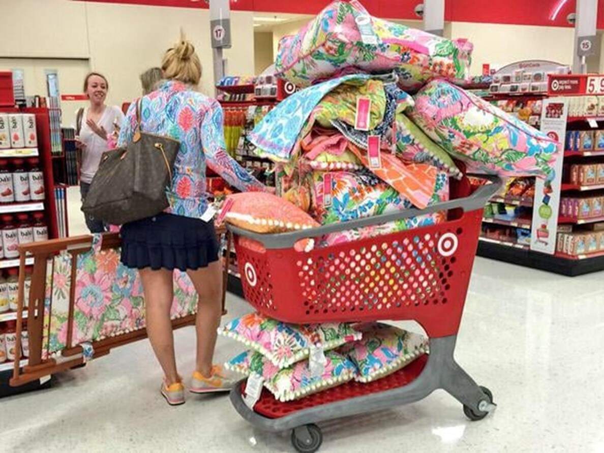 Target customer with shopping cart full of Lilly Pulitzer items