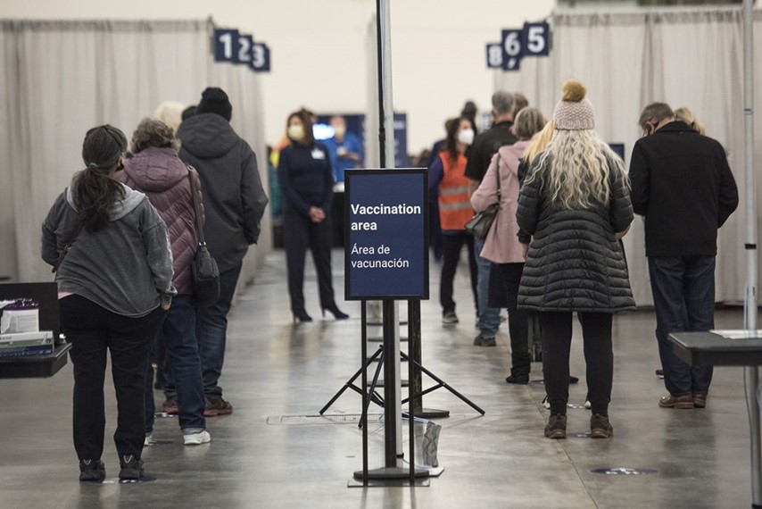 People wait in line for vaccine