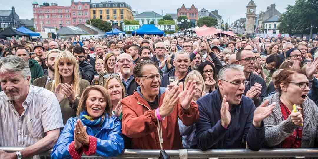 crowd of people cheering
