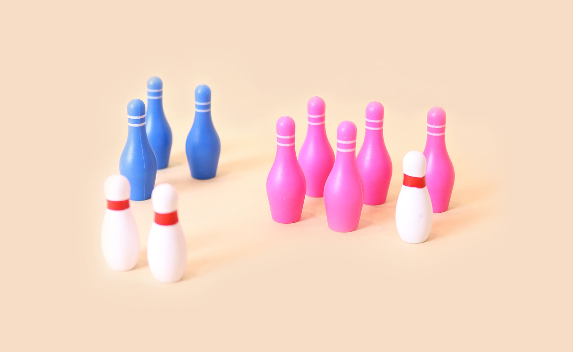 Blue, pink & white bowling pins in groups